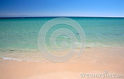 Gentle lapping waves on Tarifa beach in southern Spain Stock Photo