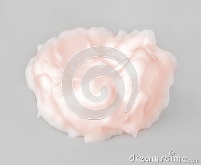 Gentle liquid cosmetic cream with elements splash in the pastel pink or pearl colors on grey background Stock Photo