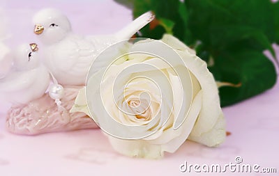 Gentle love blurred background white rose figurines pigeons with selective focus Mother`s Day Stock Photo