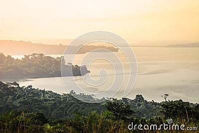 Gentle and soft yellow light at dawn over Lake Victoria Stock Photo