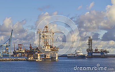 The Geo Caspian a Seismic Vessel, sailing by the stacked Oil Rigs as it departs Las Palmas Port. Editorial Stock Photo