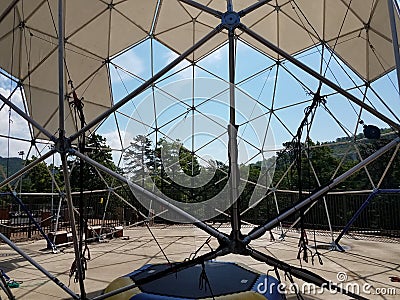 Geodesic dome with metal poles and triangles Stock Photo