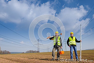 Geodesist two man equipment on construction site Stock Photo