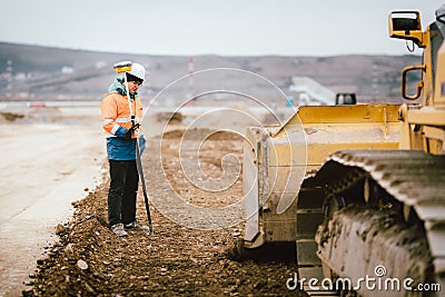 Geodesy details - construction site workers building highway and roads. Surveying engineer details Stock Photo