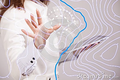 Geographic information systems concept, woman scientist working with futuristic GIS interface on a transparent screen. Stock Photo