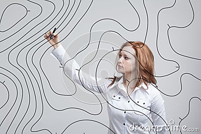 Geographic information systems concept, woman scientist working with futuristic GIS interface on a transparent screen. Stock Photo