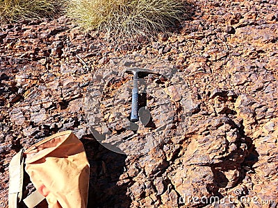 Geology pick and bag with spinifex Stock Photo