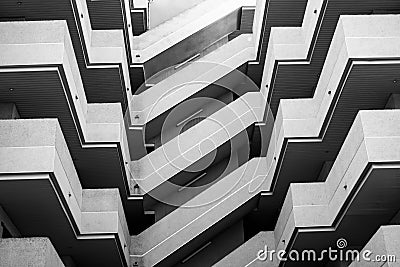 Geometric abstract building with stairs, floors, minimalistic modern architecture, concrete composition, black and white Stock Photo