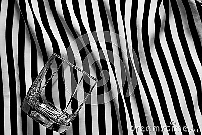 Geometric black and white background with a glass of old fashioned Stock Photo