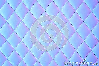 Geometric diamond pattern quilted PU leather in neon light Stock Photo