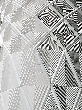 Geometric diamond white patterns and cladding on wall of a moder Stock Photo
