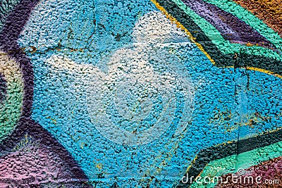 Geometric graffiti close-up on concrete block wall texture. Light blue, multicolored Stock Photo