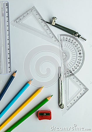 Geometric Measuring tools, Drawing items and mathematical instruments placed on white paper sheet. Back to school and Engineering Stock Photo