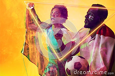 Geometric neon over african american fans with flags celebrating success during soccer match Stock Photo