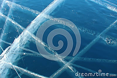 White intersecting lines on dark-blue transparent ice Stock Photo