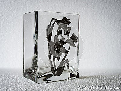 A geometric, rectangular patterned clear glass vase. Stock Photo