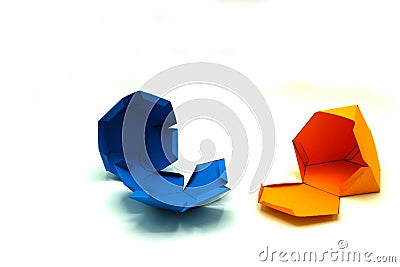 Geometric shape cut out of yellow and blue paper and photographed on white background.Geometry net of Truncated Stock Photo