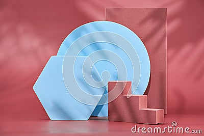 Geometric shapes on a red background, empty podiums for the presentation of various products, abstract geometric Stock Photo