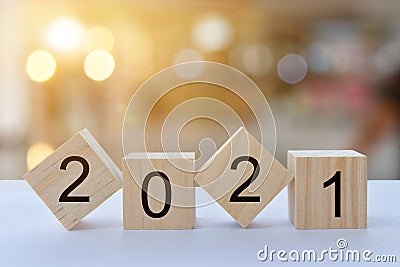 Geometric wood cubes on table with numbers 2021 Stock Photo