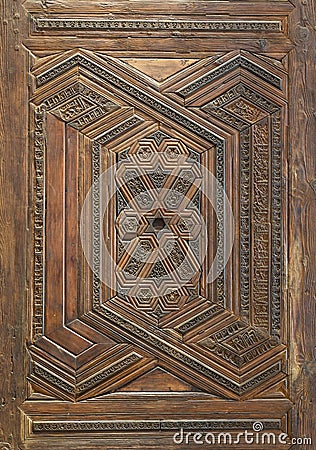 Geometrical and floral engraved patterns of Mamluk style wooden ornate door leaf Stock Photo