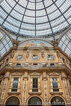 Geometrical and historical Interior of Galleria Vittorio Emanuele II in front of Cathedral of Milano, Milan, Italy Editorial Stock Photo