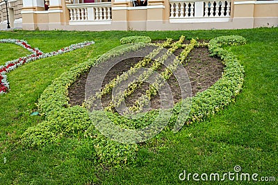 Geometrically planted flower bed with flowers in the form Stock Photo