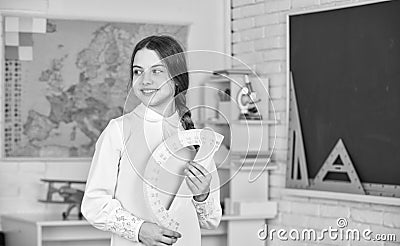 Geometry set. Small child girl holding school protractor for geometry lesson. Learning to use protractor. back to school Stock Photo
