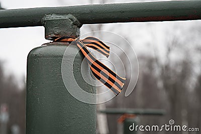 George ribbon hanging on the anvil of anti-aircraft guns. The road of life Stock Photo