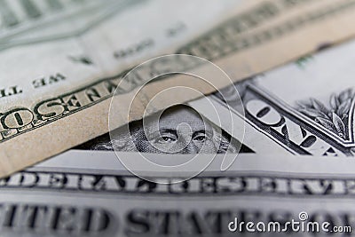 George Washington`s eyes peering over other dollar bills because you did something wrong Stock Photo