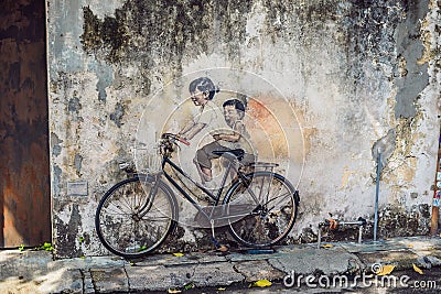 Georgetown, Penang, Malaysia - April 20, 2018: Public street art Name Children on a bicycle painted 3D on the wall that Editorial Stock Photo