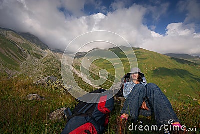 Georgia, Racha - August 17, 2013: The traveling girl rests against the backdrop of an amazing view Editorial Stock Photo