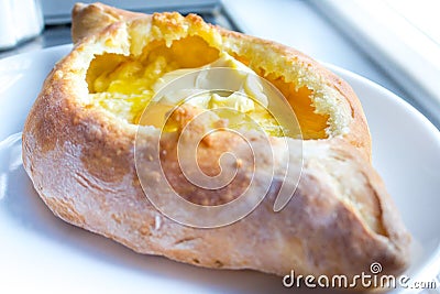 Georgian cuisine: ajaruli khachapuri - Georgian bread with egg a Stock Photo