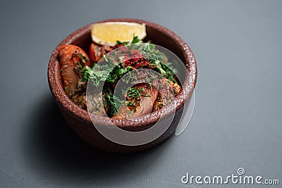 georgian cuisine dish or roasted veal brain with tomato, onion and spice Stock Photo