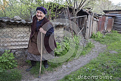 Georgian elderly lady walking and looking Editorial Stock Photo