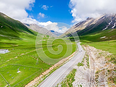 Georgian Military Road surrounded by high picturesque mountains, beautiful scenery of Georgia Stock Photo