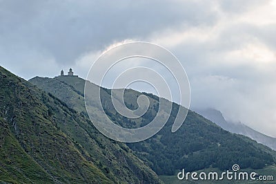 Gergeti Trinity Church Georgia Europe Kazbegi cloudy mountains landscape caucasus Stock Photo