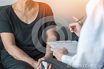 Geriatric doctor geriatrician consulting and diagnostic examining elderly senior adult patient older person on aging Stock Photo