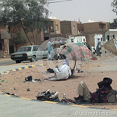 People resting and chating in the street Editorial Stock Photo