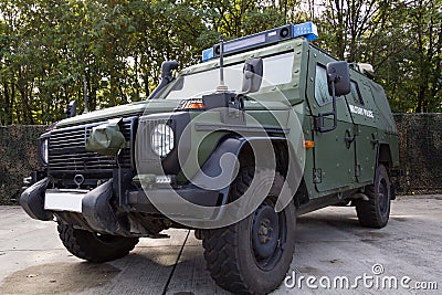 German armored military police vehicle stands on platform Stock Photo