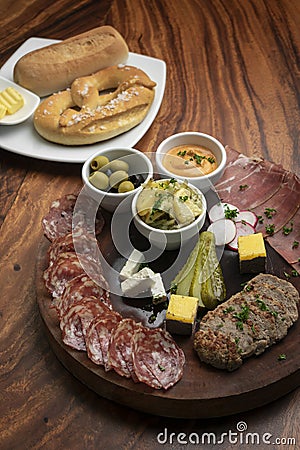 German cold cuts tapas snack platter with meats and bread Stock Photo