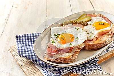 German Country breakfast of sliced ham and eggs Stock Photo