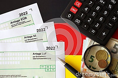German different tax declaration blank forms - Anlage EUR, Anlage SZ and Anlage Luf. Documents lies with calculator, pen and Stock Photo