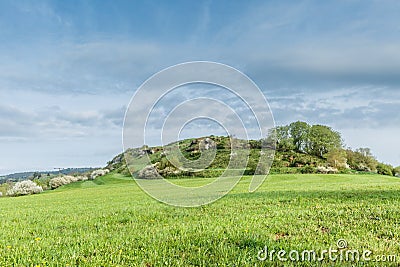 German Eifel landscape in spring with gentle slopes and budding green of trees Stock Photo
