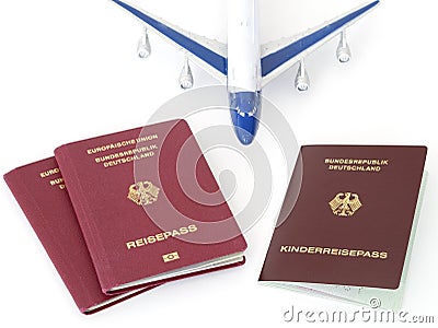 German family passports with plane isolated white background Stock Photo