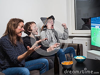 German family is watching football world cup soccer on tv Stock Photo