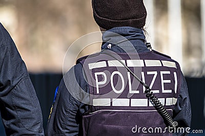 German Federal police officer woman protecting the city Stock Photo