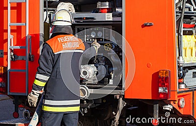 German Fire Department firefighter on Fire Truck Stock Photo