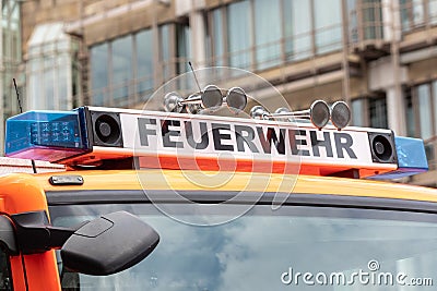 German Fire Truck with Feuerwehr Sign and Emergency Lights: First Responder and Public Safety Equipment Stock Photo