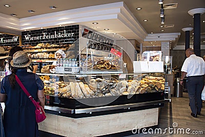 German and foreign travelers looking select and buy food and bread at restaurant in heidelberger market in Heidelberg, Germany Editorial Stock Photo
