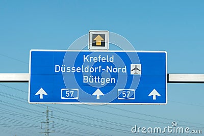 German highway autobahn blue road sign leading to airport duesseldorf Stock Photo